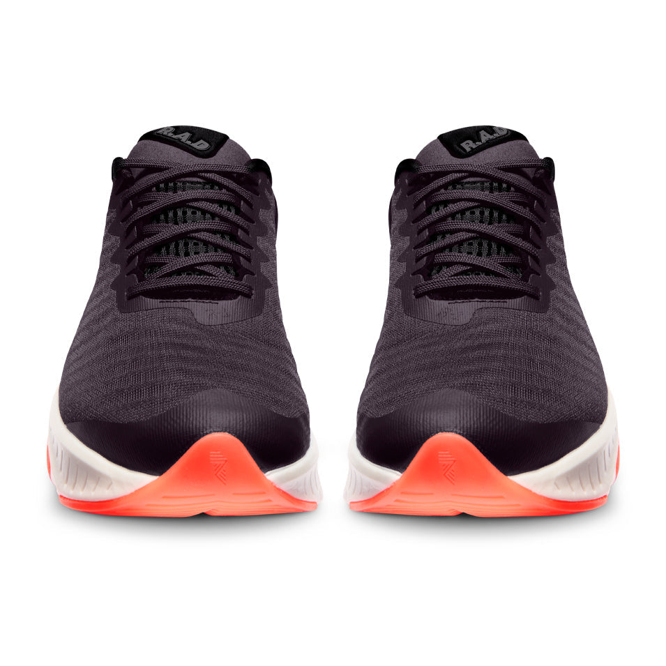 Pair of black running shoes with orange accents.