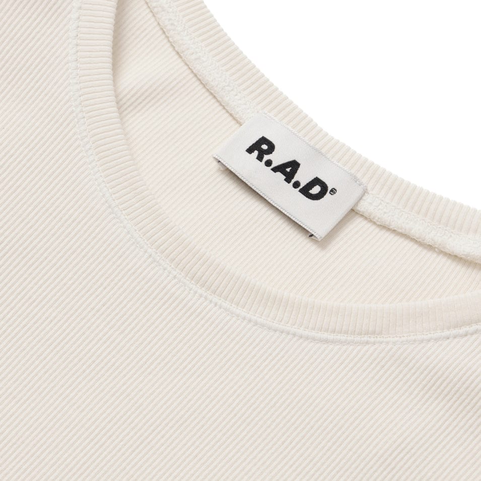 White ribbed knit top with brand tag.