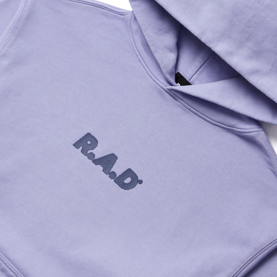 Lavender hoodie with ’RAD’ printed on the front.