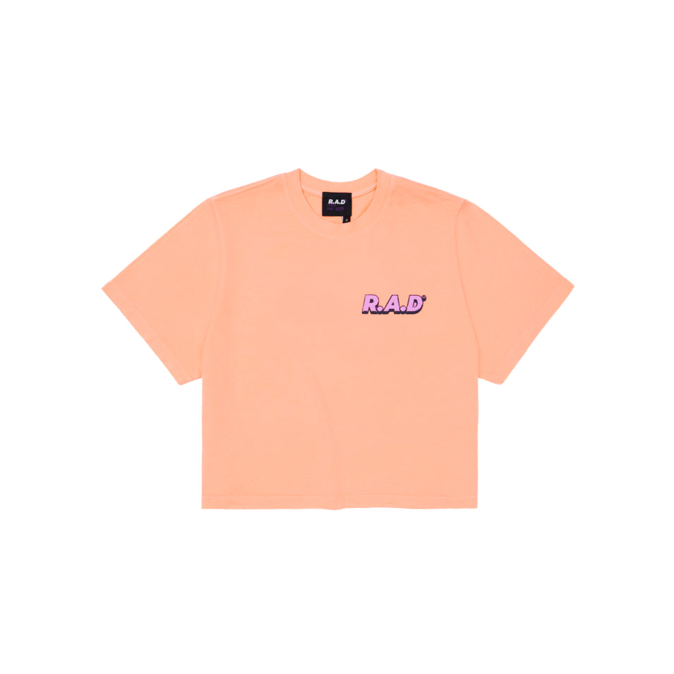 Peach-colored short-sleeved t-shirt.