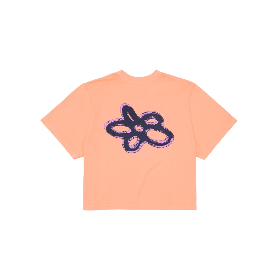 Peach-colored crop top with abstract floral design.
