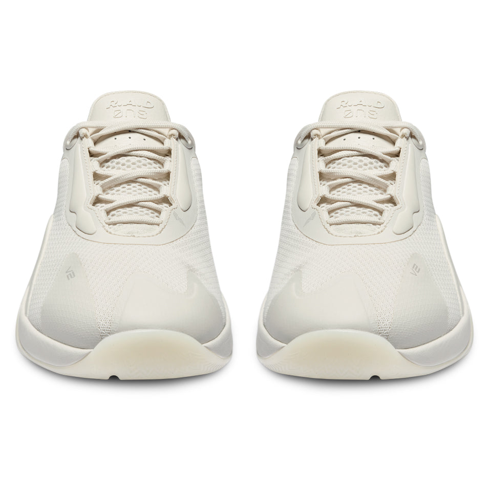 Pair of off-white sneakers.