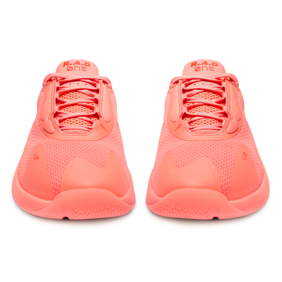 Pair of coral-colored athletic shoes from R.A.D® ONE V2 FLOWER BLUSH collection