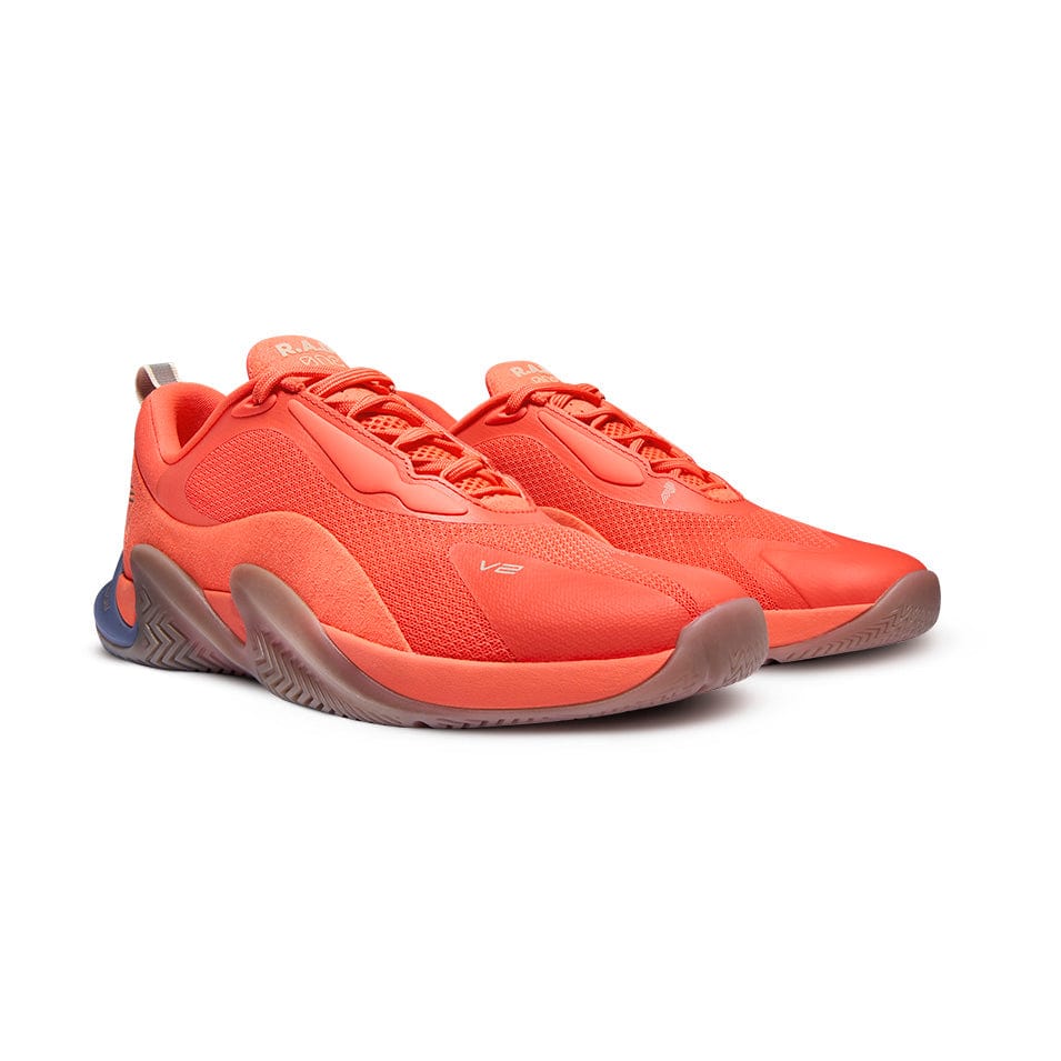 Pair of orange athletic shoes.