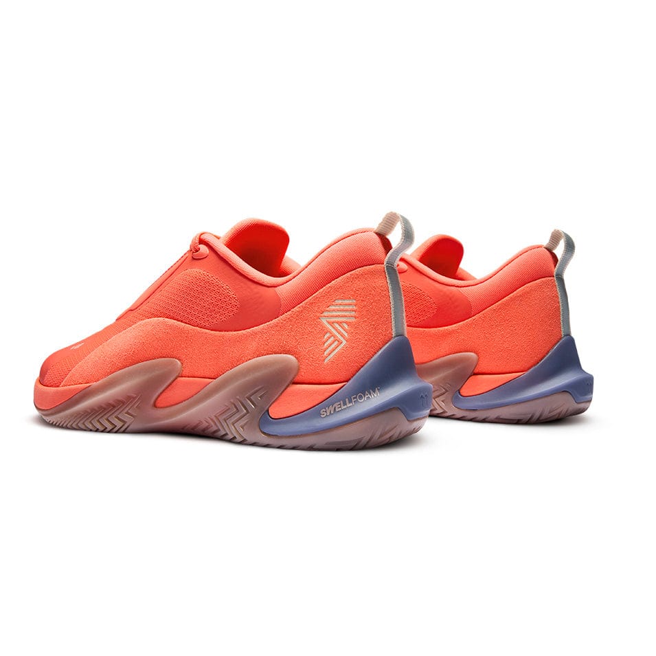 Pair of coral-colored athletic shoes.