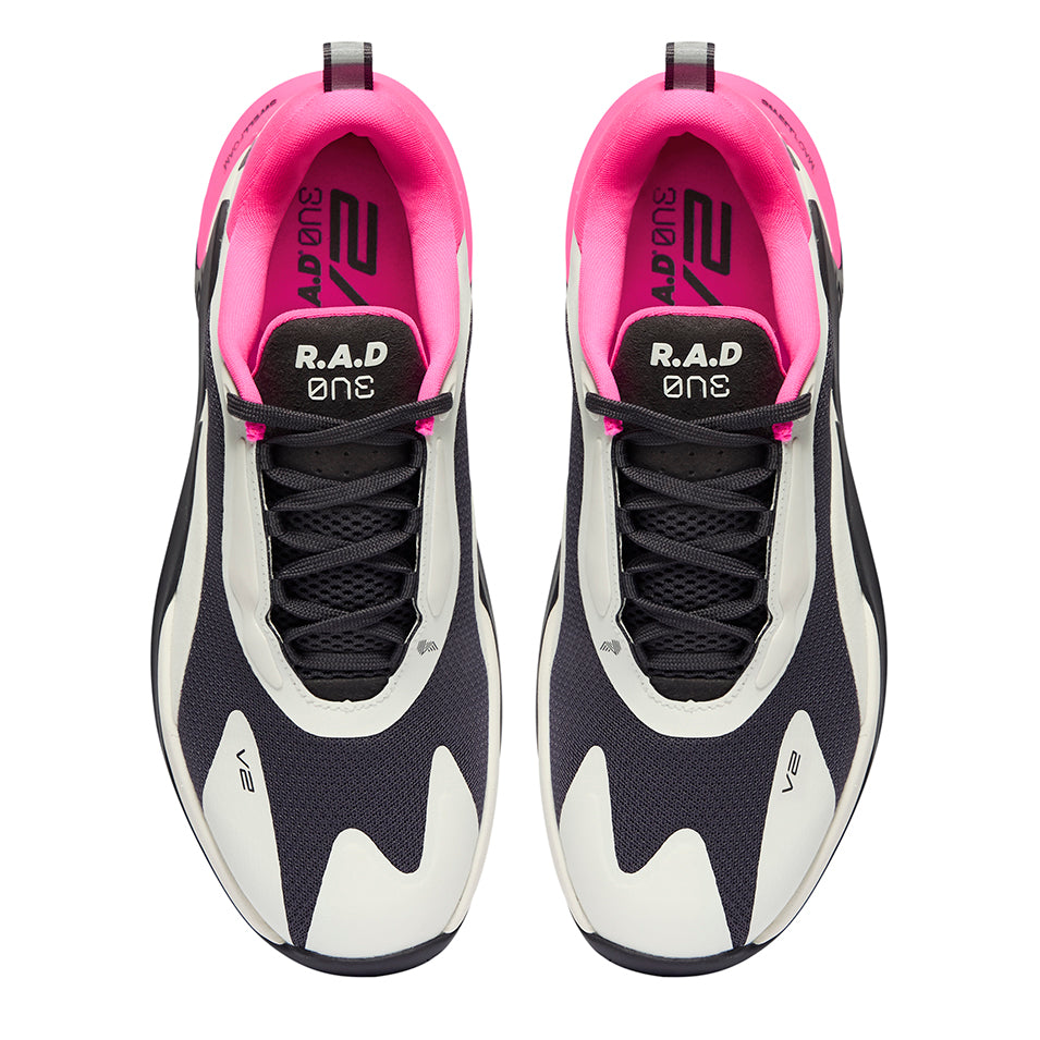 Pair of black and white athletic shoes with pink lining.