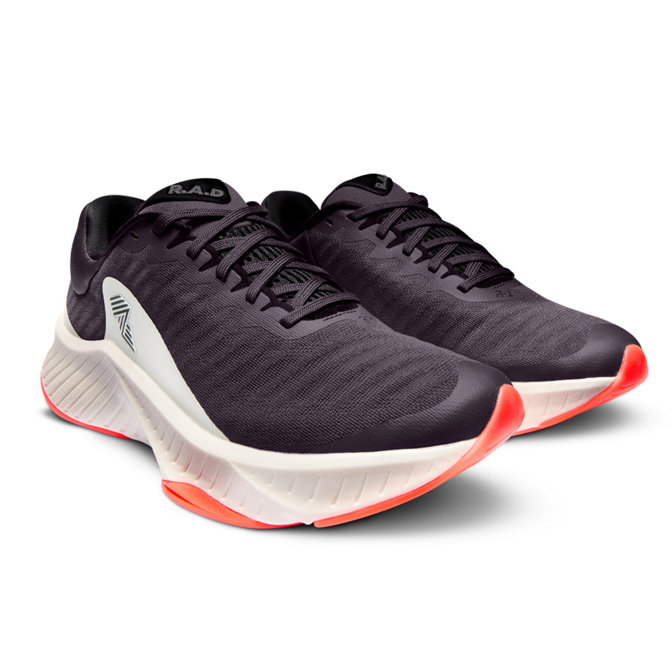 Pair of black running shoes with white and orange soles.