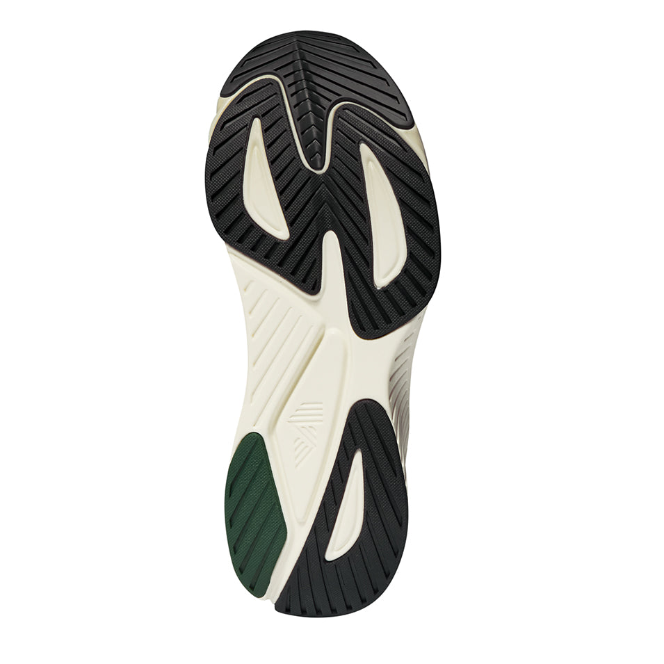 Shoe sole with black and cream pattern.