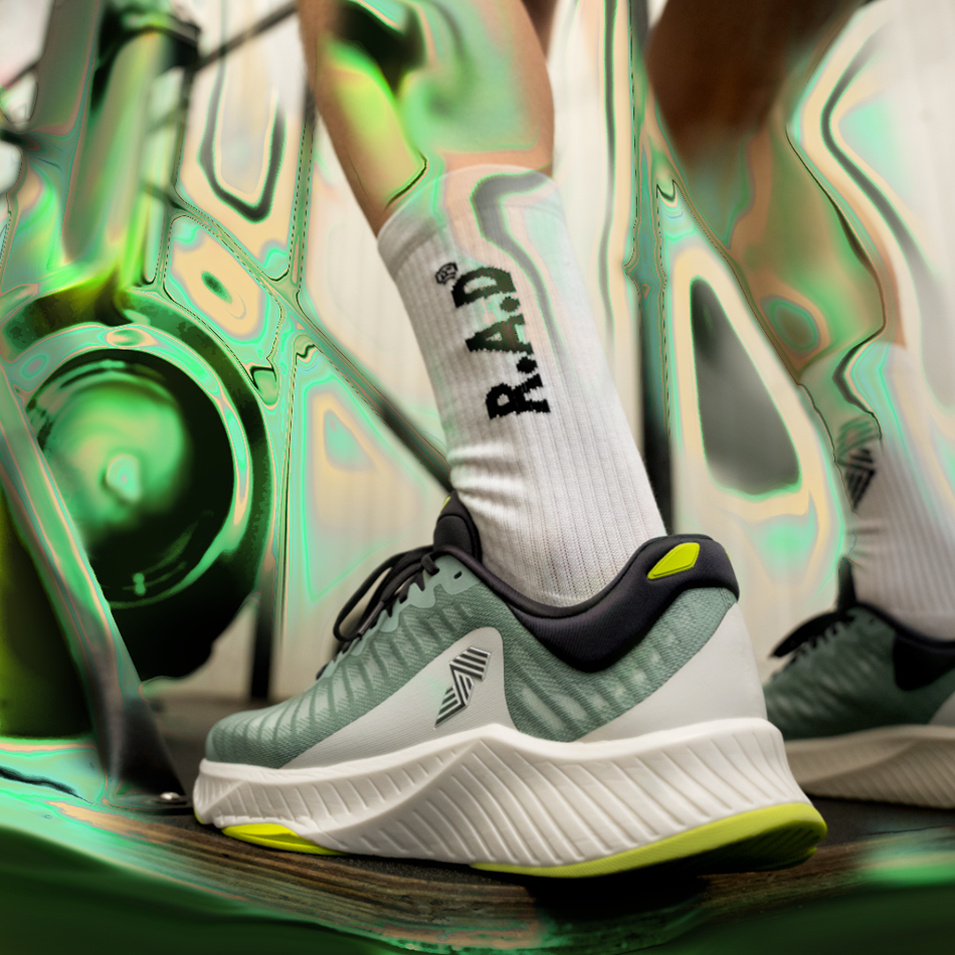 Running shoe with white sock.