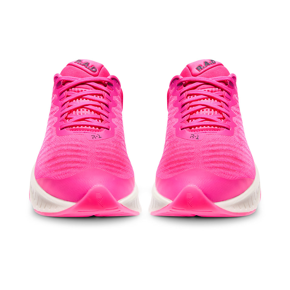 Pair of bright pink running shoes.