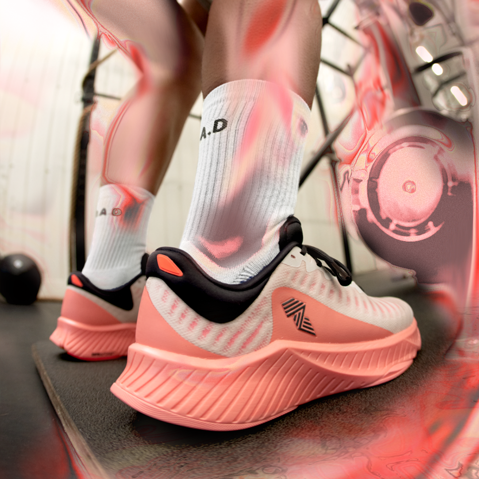Pink and white running shoe.