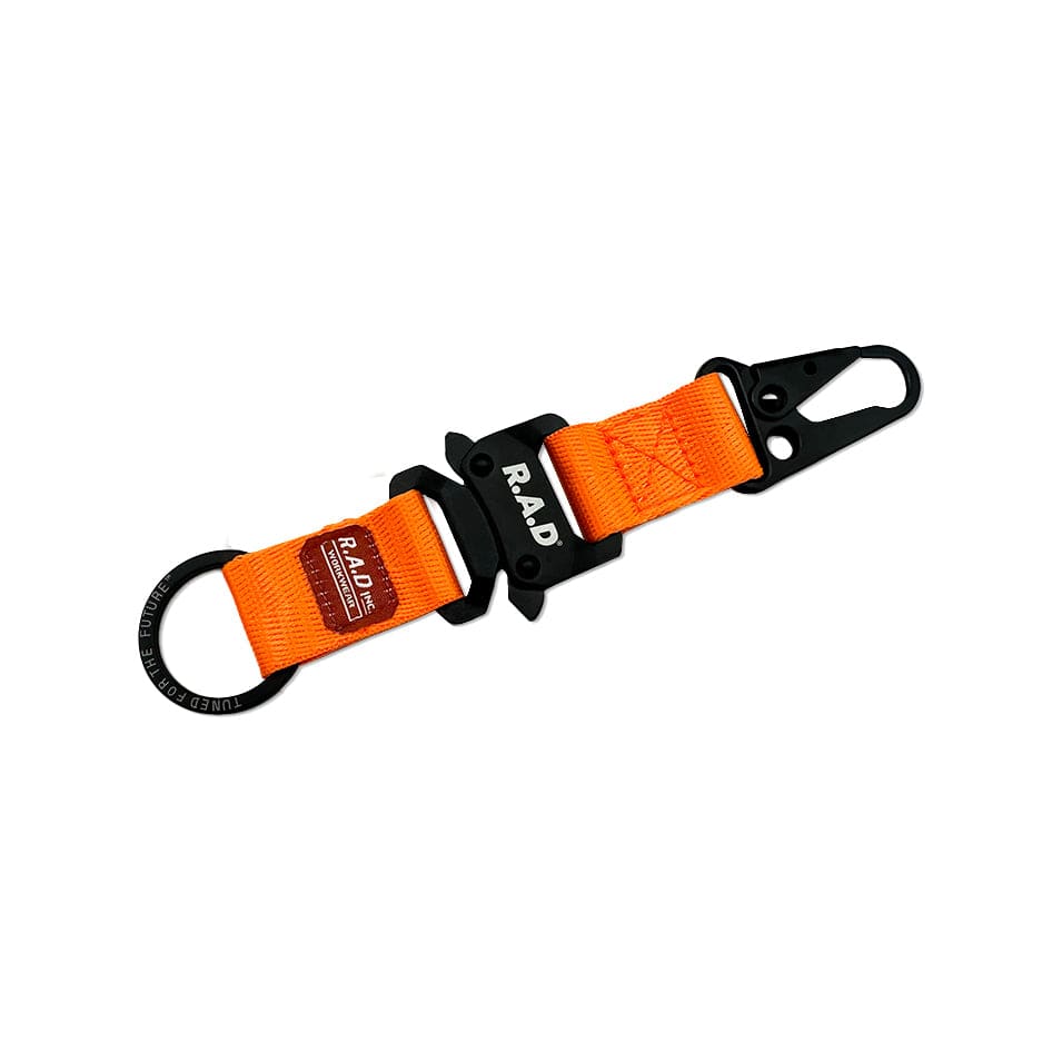 Orange fabric keychain with black metal snaphook melon and snake buckle hardware