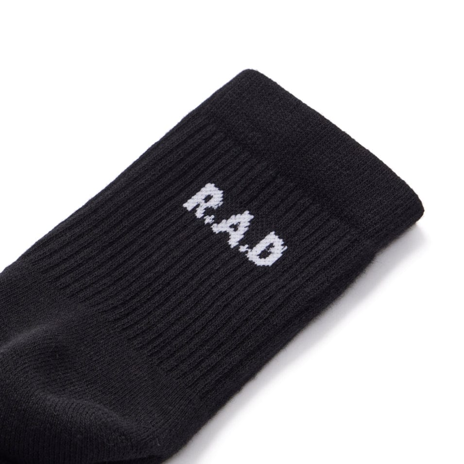 Black shortie sock with white lettering from the SHORTIE SOCK TRIPLE PACK BLACK collection