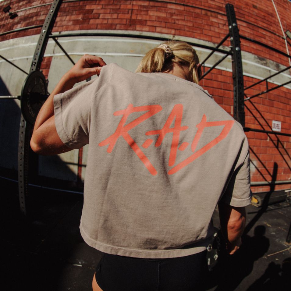 Orange Sketch Crop Dust top featuring a Tan crop top with RAD graphic design