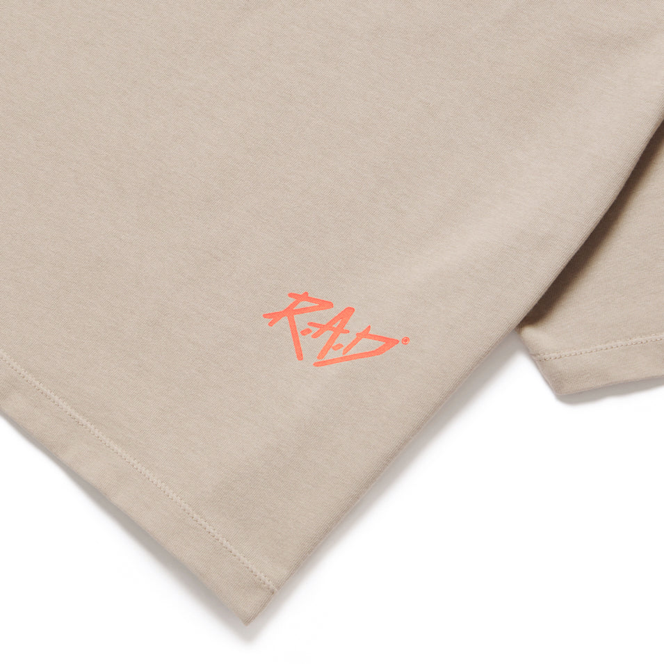 Beige fabric with orange Sketch Crop Dust Orange logo on the product display